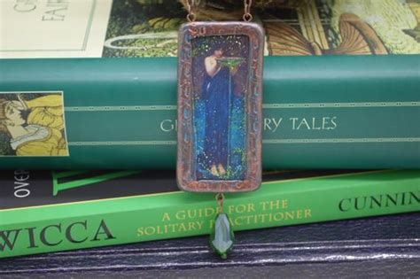 Connecting with the divine feminine through the sorceress pendant.